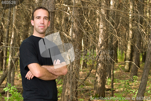 Image of Man Standing In The Forest
