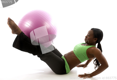 Image of young pretty hispanic african american woman exercising with fit