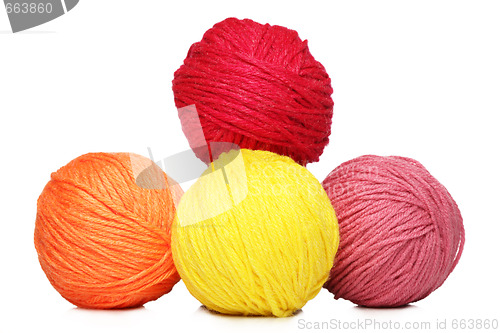Image of Colorful yarn balls over white background