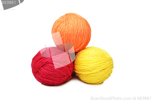 Image of Colorful yarn balls over white