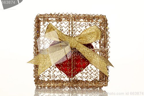 Image of Red heart in a golden gift box