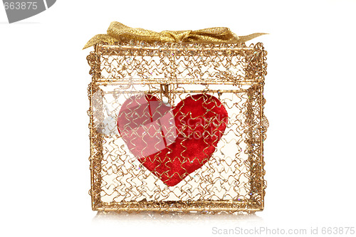 Image of Red heart in a golden gift box