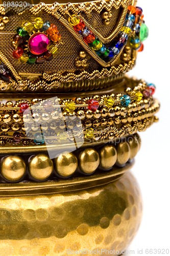 Image of stack of golden bracelets