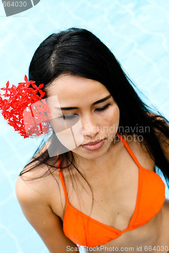 Image of Asian woman in a bikini.