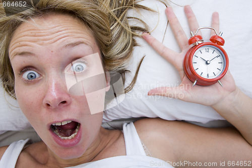 Image of Woman waking up Late