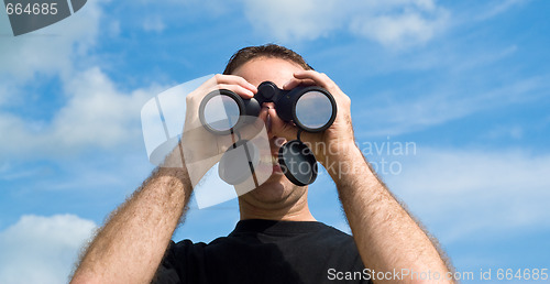 Image of Man Using Binoculars Outside