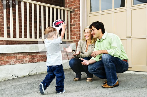 Image of Family playing with soccer ball