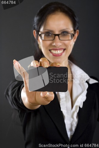 Image of closeup of an attractive businesswoman presenting a card