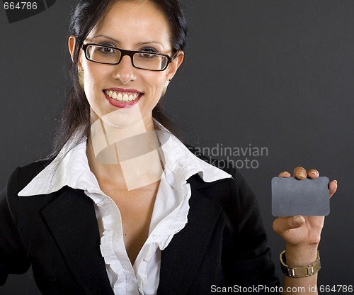 Image of picture of an attractive businesswoman presenting a blank card