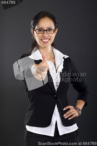 Image of picture of an attractive businesswoman making her ok sign