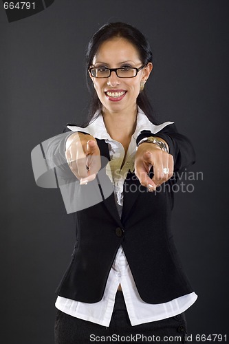 Image of attractive businesswoman pointing to you with both hands