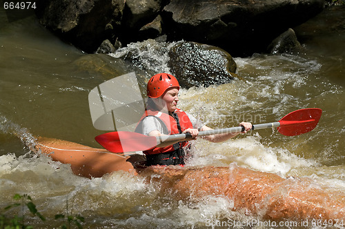 Image of girl white water kayaking