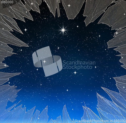 Image of bright star through smashed window