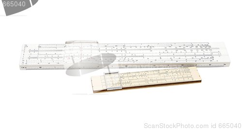 Image of Two vintage slide rule mechanical calculators isolated