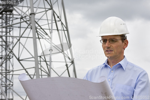 Image of Engineer reading a plan