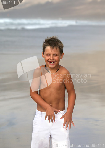Image of smiling boy in the towel