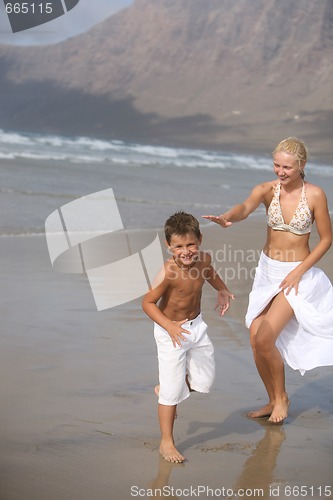 Image of Happy Mother and son on the beach