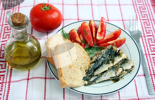 Image of sardines with tomato and bread