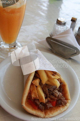 Image of Souvlaki and orange juice