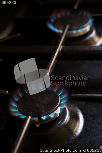 Image of Lit gas cooker burners