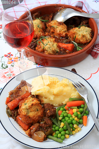 Image of Beef stew and serving bowl vertical