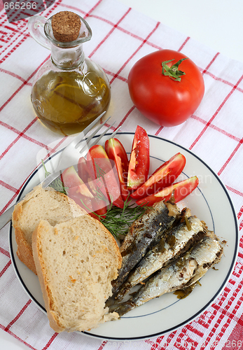 Image of sardines bread and tomato vertical