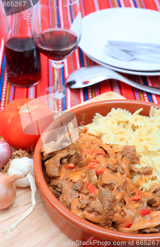 Image of Beef stroganoff bowl with pasta vertical