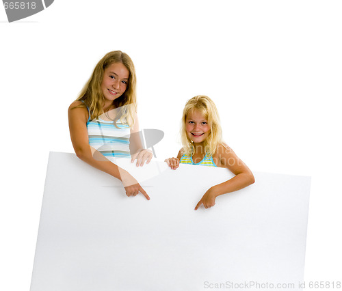 Image of sister girls with white board