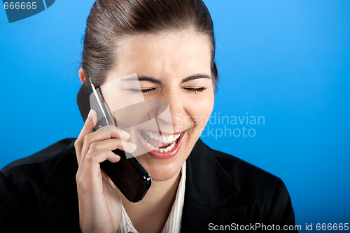 Image of happy businesswoman calling at phone