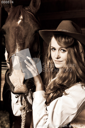 Image of Beautiful girl with her horse
