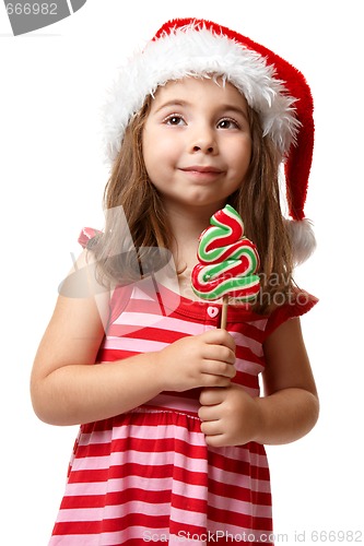Image of Pretty santa girl with christmas lollipop