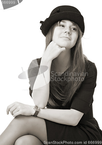 Image of smiling young woman in black hat