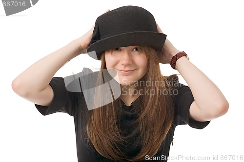 Image of smiling young woman in black hat