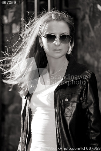 Image of young beautiful girl in sun glasses