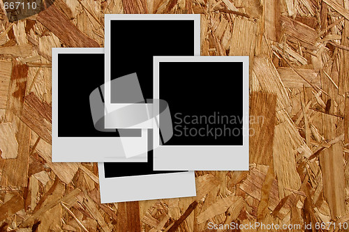 Image of Pile of  empty photo frames  on wood background