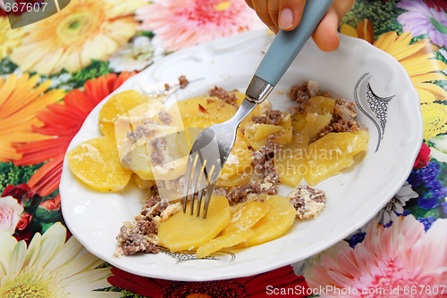 Image of Baked potatoes with meat in plate