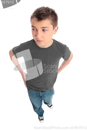 Image of Boy in grey t-shirt and blue jeans