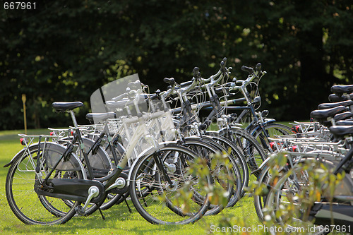 Image of Many bicycles at Bicycle stand in line