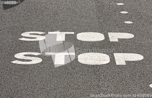 Image of  stop sign on paved road