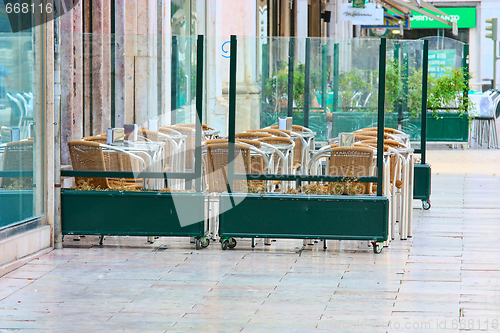 Image of empty tables in street cafe