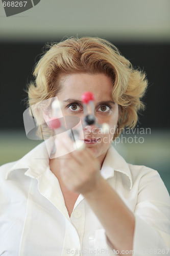 Image of Female researcher analyzing a molecular structure