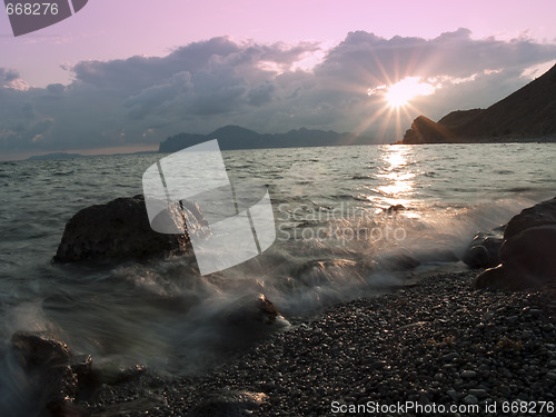 Image of Sunset at sea shore