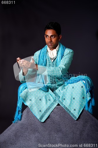 Image of Hindu man sitting in lotus position