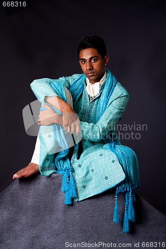 Image of Hindu man sitting on rock