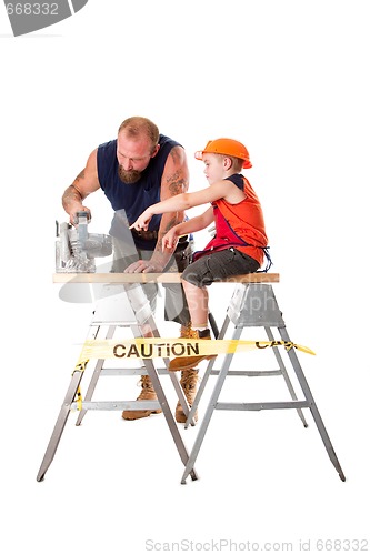 Image of Dad with son and circle saw