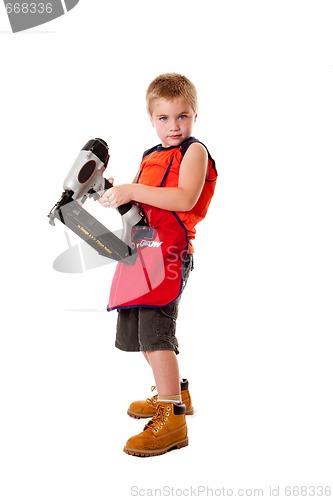 Image of Cute boy with nail gun