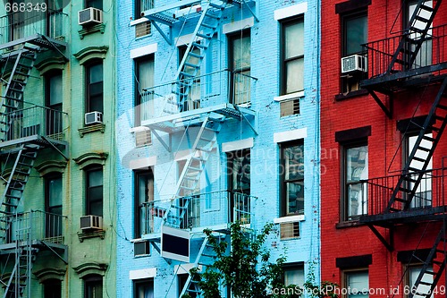 Image of Colorful apartment buildings with fire escapes