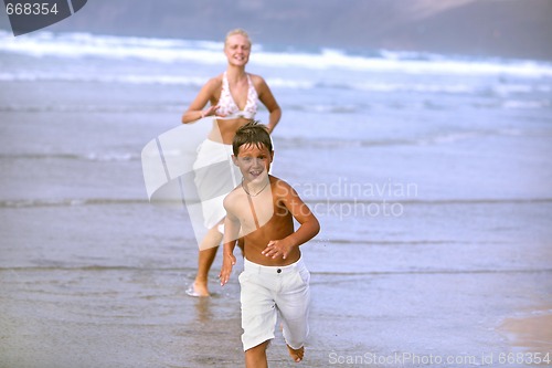 Image of Happy Mother and son on the beach