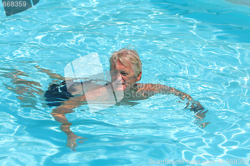 Image of mature man in the pool 
