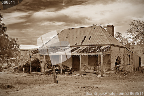 Image of old farmhouse ruins in sepia